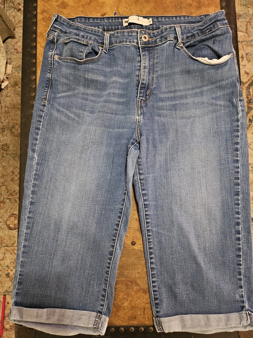 Levi's light blue denim jeans with embossed metal button